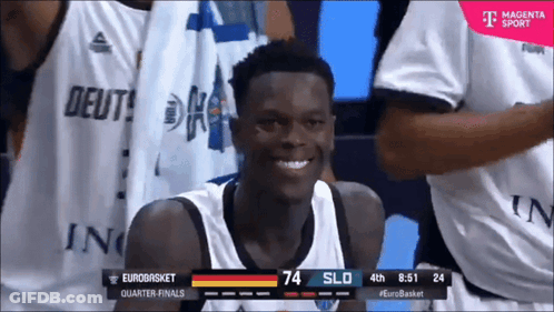 A Basketball Player Is Smiling In Front Of A T-Mobile Ad GIF