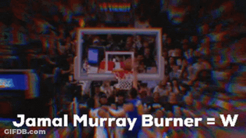A Basketball Player Is Standing In Front Of A Crowd Of People . GIF