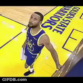 A Basketball Player Is Standing On A Basketball Court Looking Up . GIF