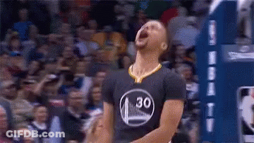 A Basketball Player Is Standing On A Court With His Mouth Open And A Crowd Behind Him . GIF