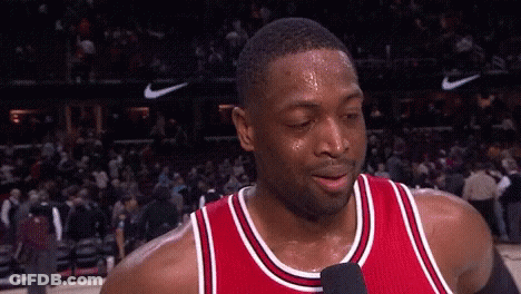 A Basketball Player Is Sweating And Talking Into A Microphone . GIF