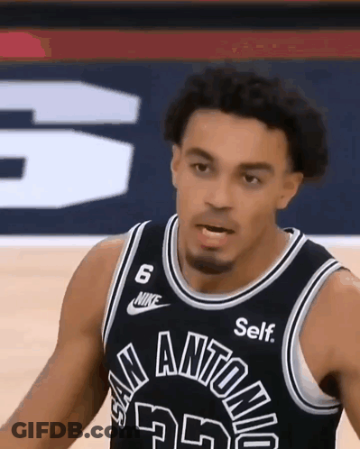 A Basketball Player Is Wearing A Black Jersey With The Number 6 On It GIF
