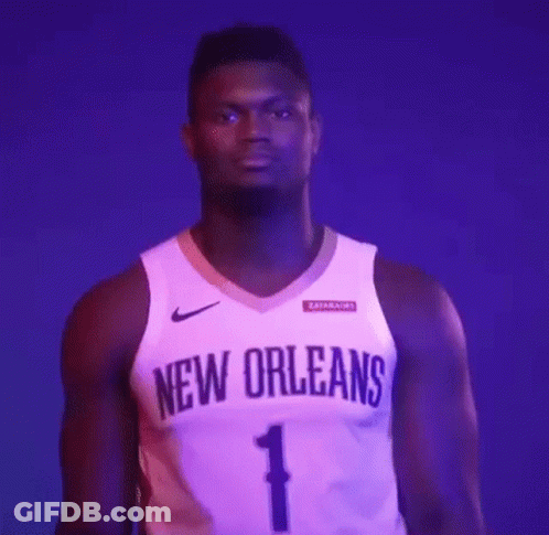 A Basketball Player Is Wearing A New Orleans Jersey And Standing In Front Of A Purple Background . GIF