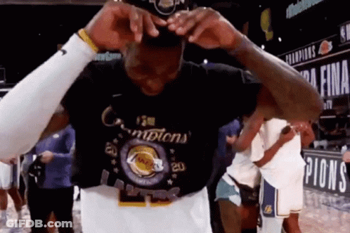 A Basketball Player Is Wearing A T-Shirt That Says Champions . GIF