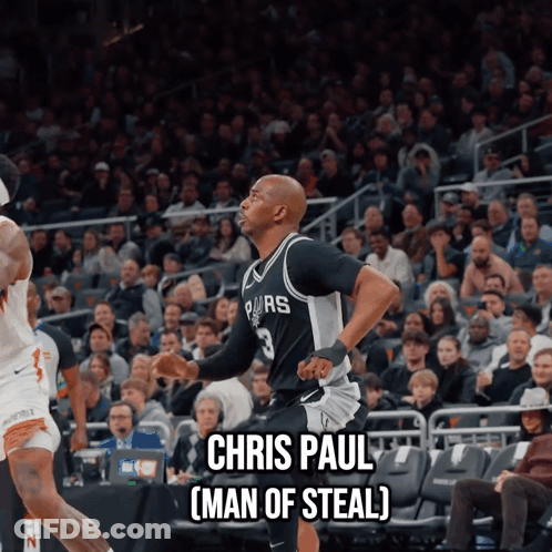 A Basketball Player Named Chris Paul Is Running On The Court In Front Of A Crowd GIF
