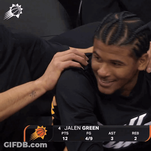 A Basketball Player Named Jalen Green Is Hugging Another Player During A Game GIF