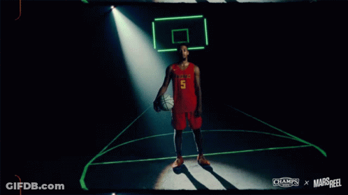 A Basketball Player Named Justyn Hunter Holds A Basketball GIF