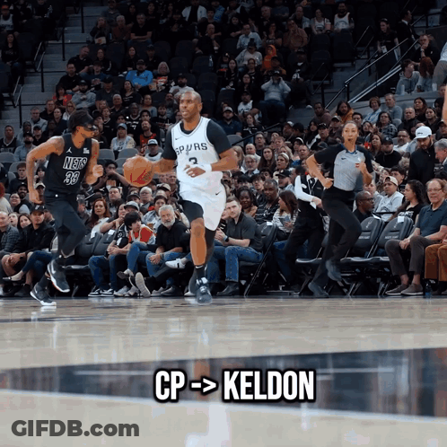 A Basketball Player Named Keldon Is Dribbling A Basketball GIF