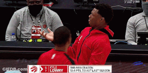 A Basketball Player Named Kyle Lowry Is Talking To Another Man GIF