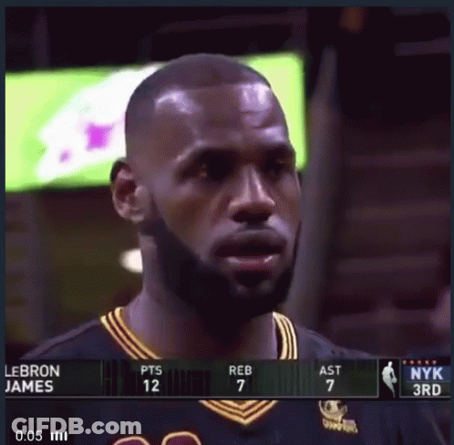 A Basketball Player Named Lebron James Is Standing In Front Of A Scoreboard GIF