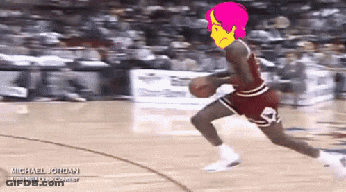 A Basketball Player Named Michael Jordan Is Dribbling A Basketball On A Court GIF