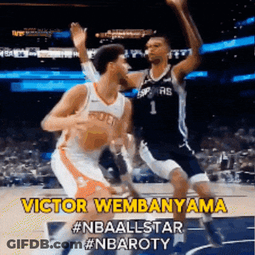 A Basketball Player Named Victor Wembenama Is Jumping In The Air GIF