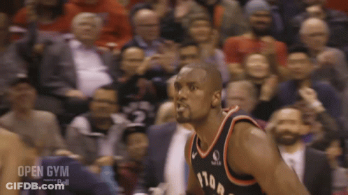 A Basketball Player Stands In Front Of A Crowd With The Words Open Gym Bell On The Bottom Right GIF