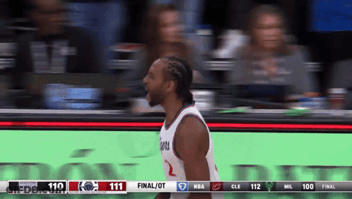 A Basketball Player Stands In Front Of A Scoreboard That Says Final / Ot GIF