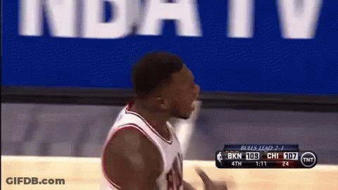A Basketball Player Stands In Front Of A Tnt Banner GIF