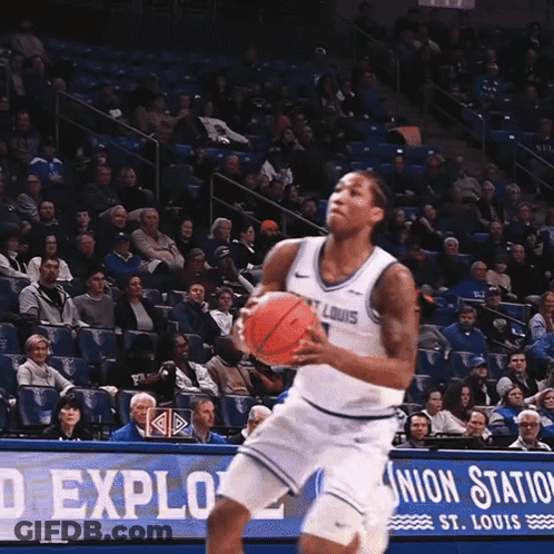 A Basketball Player Stands In Front Of A Union Station Sign GIF