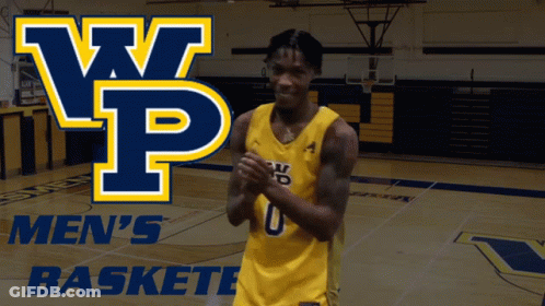 A Basketball Player Stands On A Court In Front Of A Banner That Says Men 'S Baskete GIF