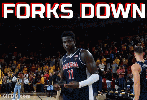 A Basketball Player Wearing A Arizona Jersey Stands On The Court GIF