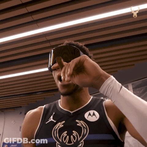A Basketball Player Wearing A Black Jersey With A Motorola Logo On It GIF