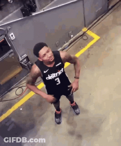A Basketball Player Wearing A Black Jersey With District 3 On It GIF