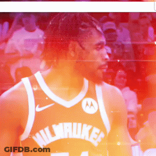 A Basketball Player Wearing A Black Jersey With The Number 34 GIF