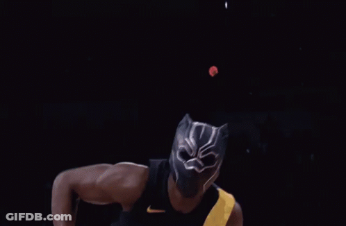 A Basketball Player Wearing A Black Jersey With The Number 4 On It Dunks The Ball GIF