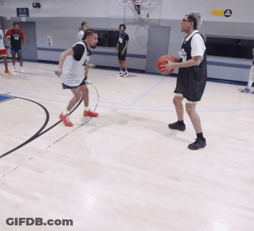 A Basketball Player Wearing A Black Jersey With The Number 8 On It GIF