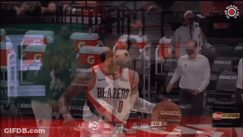 A Basketball Player Wearing A Blazers Jersey Dribbles A Basketball GIF