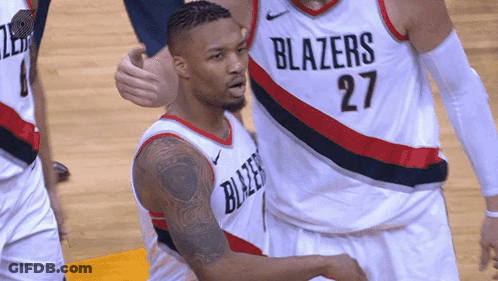 A Basketball Player Wearing A Blazers Jersey Number 27 GIF