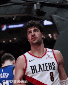 A Basketball Player Wearing A Blazers Jersey With The Number 8 On It GIF