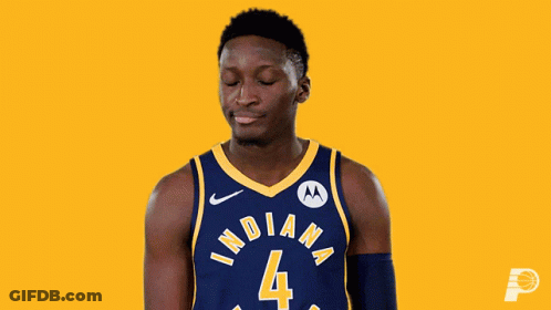 A Basketball Player Wearing A Blue And Yellow Indiana Jersey GIF