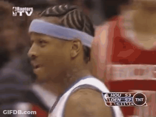 A Basketball Player Wearing A Blue Headband Looks At The Camera During A Game . GIF