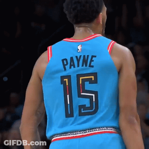 A Basketball Player Wearing A Blue Jersey With The Number 15 On It GIF