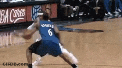 A Basketball Player Wearing A Blue Jersey With The Number 6 On It Is Dribbling The Ball . GIF