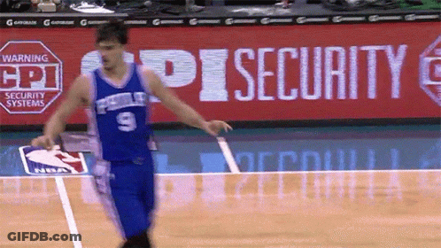 A Basketball Player Wearing A Blue Jersey With The Number 9 GIF