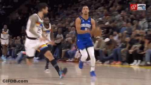A Basketball Player Wearing A Blue Orlando Jersey GIF