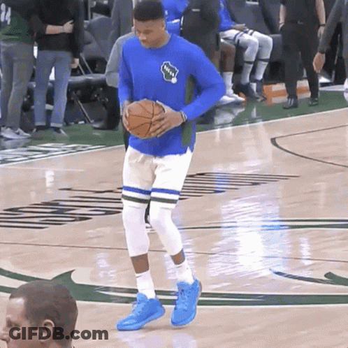 A Basketball Player Wearing A Blue Shirt That Says Bucks On It GIF