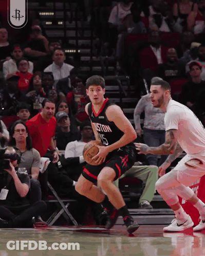 A Basketball Player Wearing A Boston Jersey Dribbles The Ball GIF