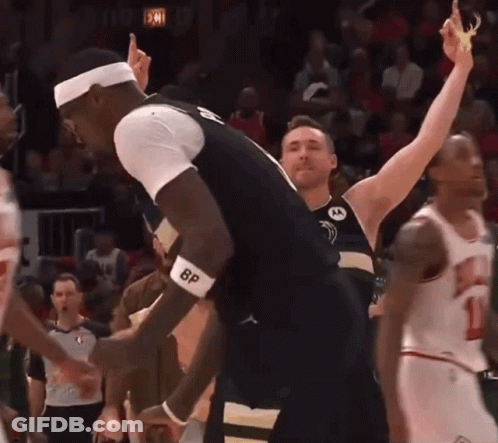 A Basketball Player Wearing A Bp Wristband Celebrates A Victory GIF