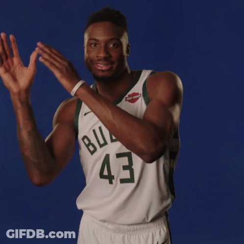 A Basketball Player Wearing A Buck 43 Jersey Is Clapping His Hands GIF