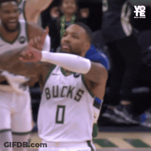 A Basketball Player Wearing A Bucks Jersey Is Giving A Thumbs Up GIF