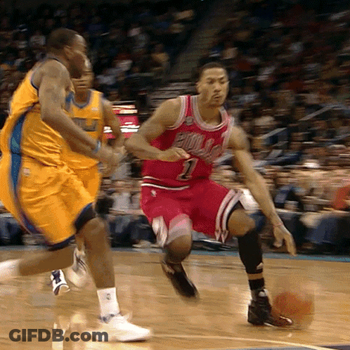 A Basketball Player Wearing A Bulls Jersey Dribbles A Ball GIF