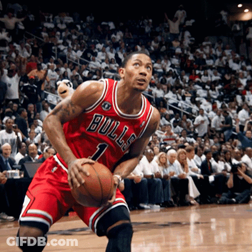 A Basketball Player Wearing A Bulls Jersey Holds A Basketball GIF