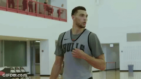 A Basketball Player Wearing A Bulls Jersey Stands On A Court GIF