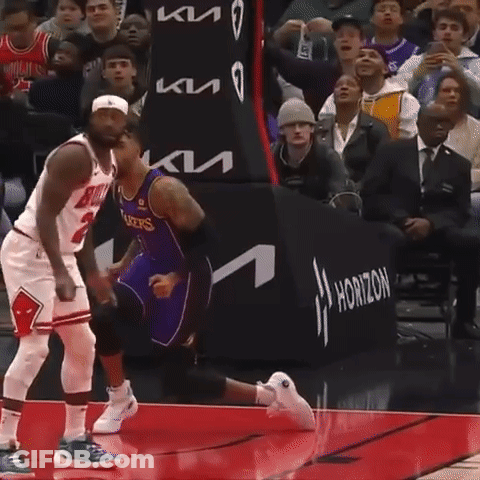 A Basketball Player Wearing A Bulls Jersey Stands On The Court GIF