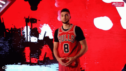 A Basketball Player Wearing A Bulls Jersey With The Number 8 On It GIF
