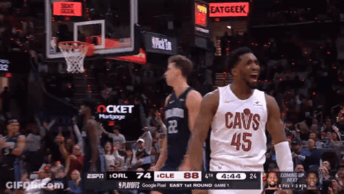 A Basketball Player Wearing A Cavs Jersey Celebrates A Basket GIF