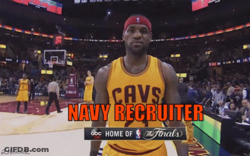 A Basketball Player Wearing A Cavs Jersey Stands In Front Of A Crowd GIF
