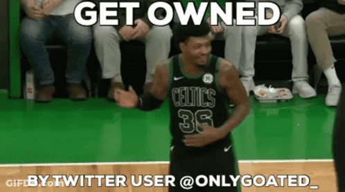 A Basketball Player Wearing A Celtics Jersey Is Dancing On The Court GIF