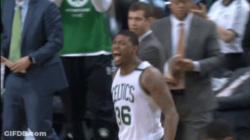 A Basketball Player Wearing A Celtics Jersey Is Screaming GIF